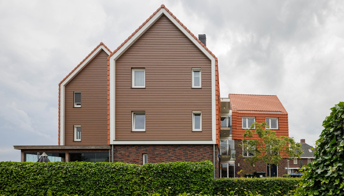 Woonvoorziening krijgt onderhoudsarme gevelbekleding met houtlook